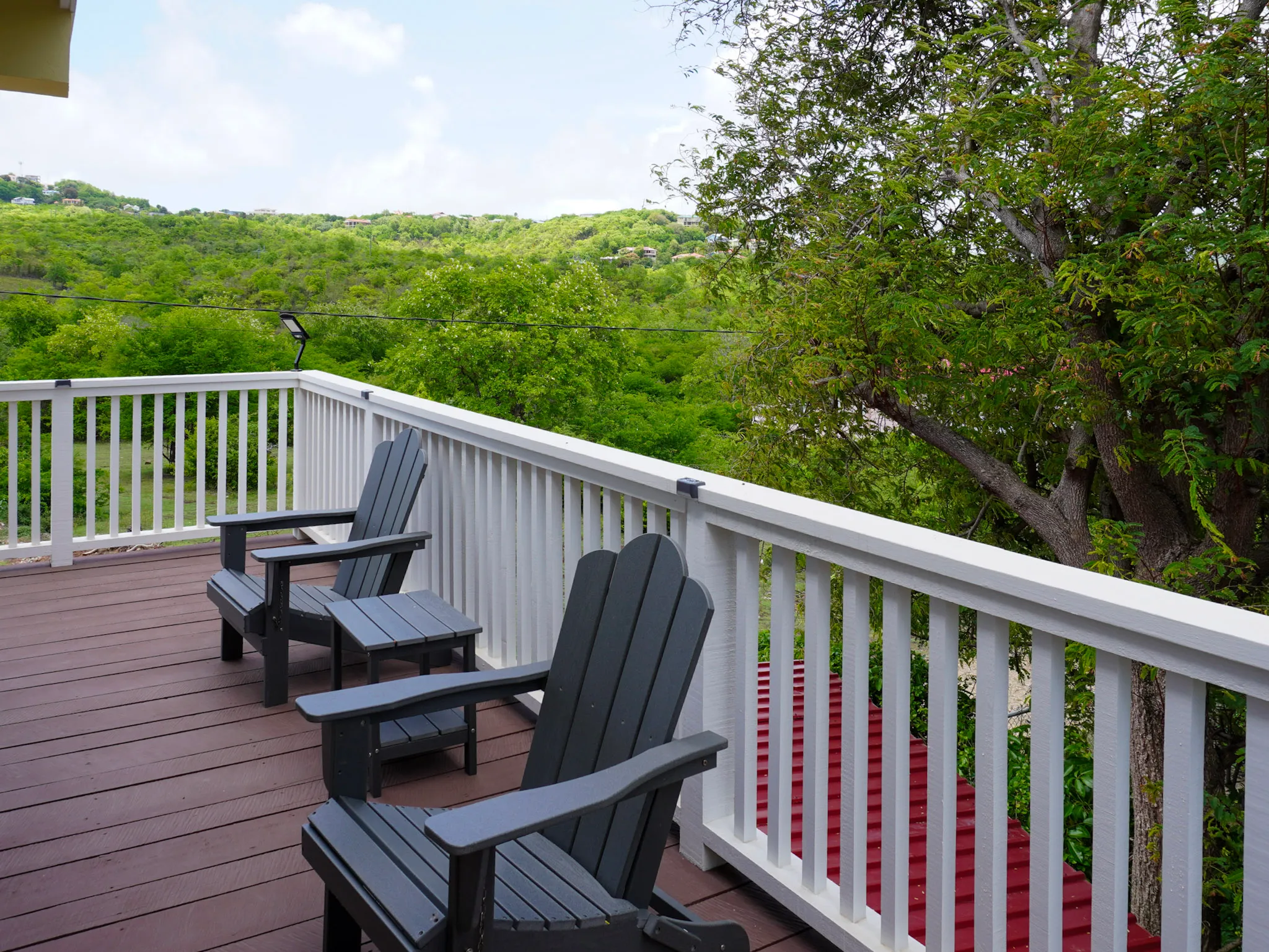 Private balcony with hillside views over Gros Islet