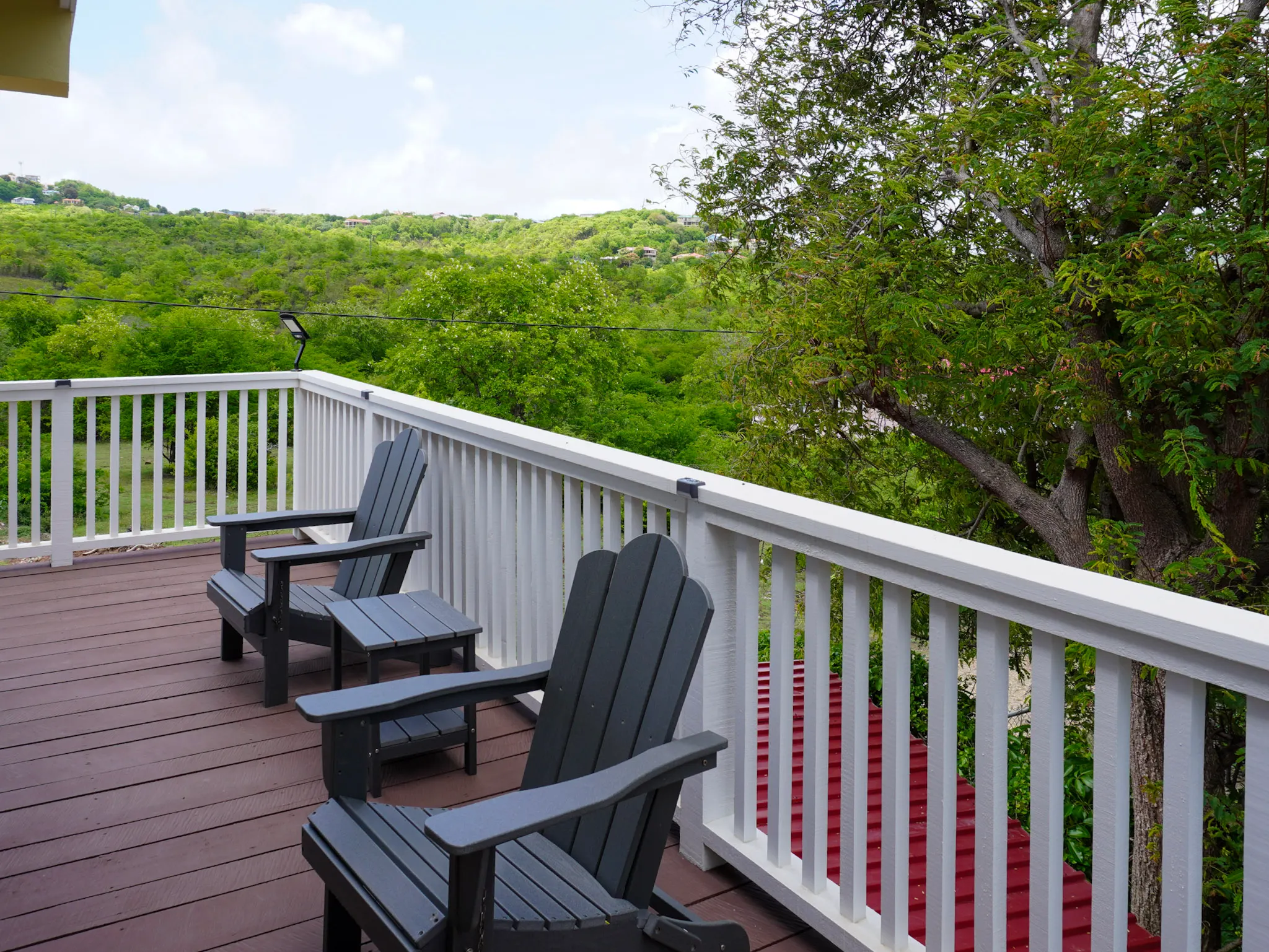 Private balcony seating overlooking the hillside