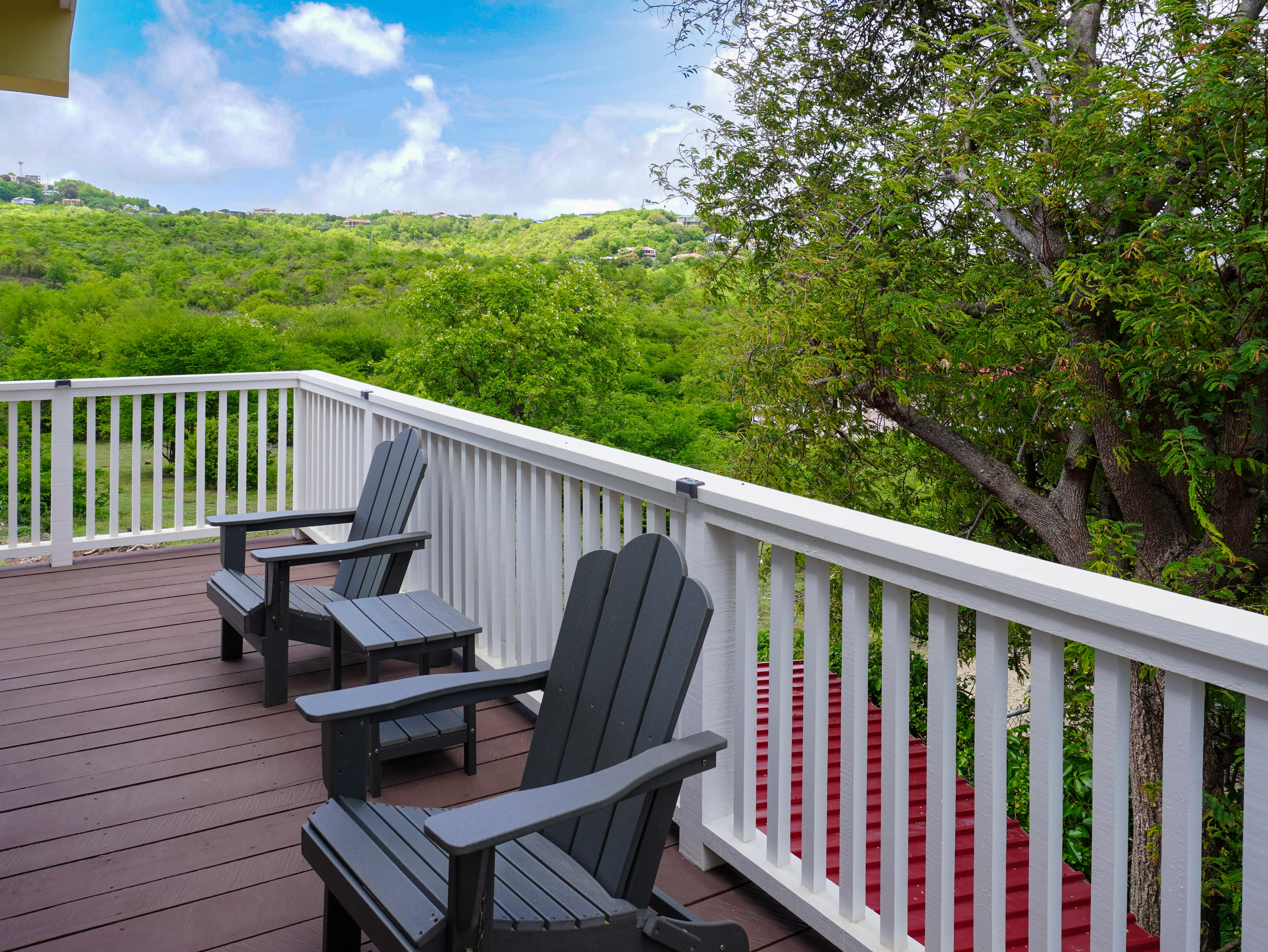 Private balcony seating overlooking the hills