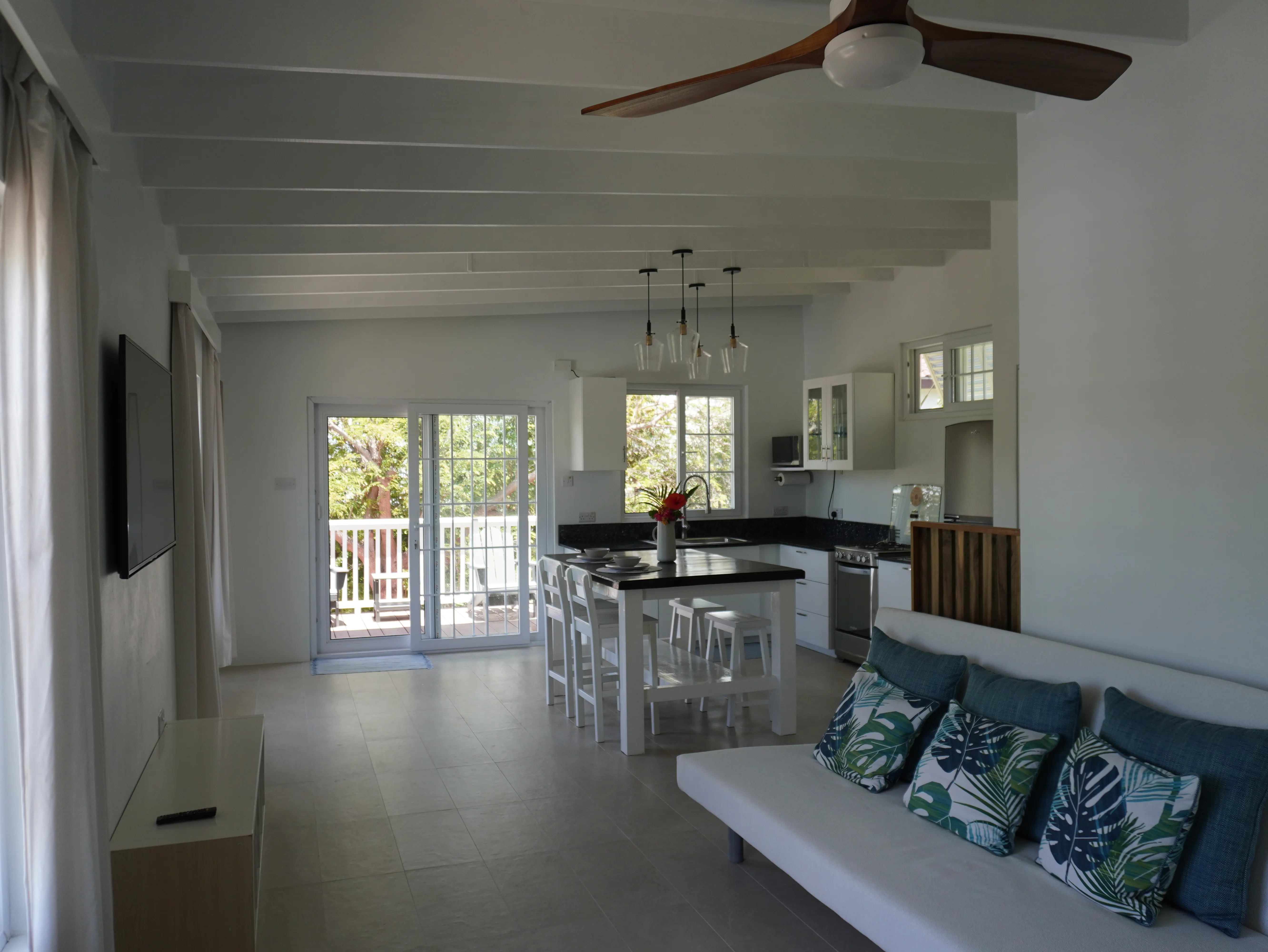 Wide view of the living, dining and kitchen area from the sofa